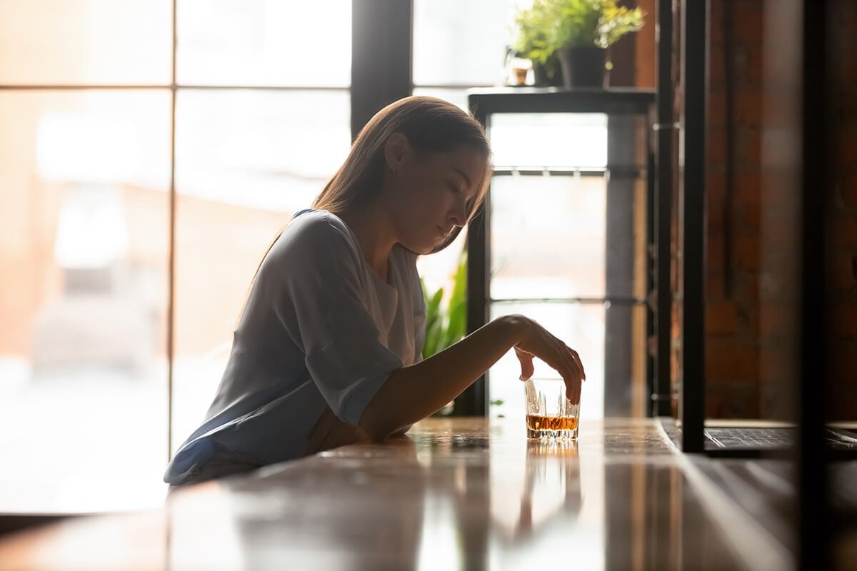 woman holding a drink